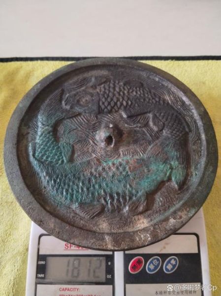 辽金双鱼镜价格_辽金双鱼镜真假辨别